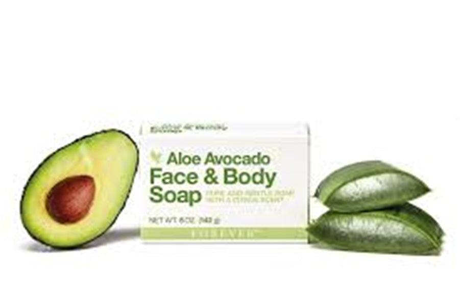 Aloe Avocado Face & Body Soap with an avocado half and leaves on a white background