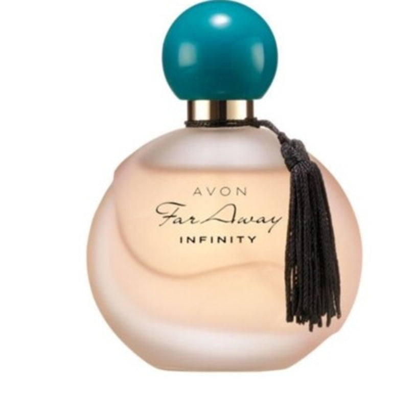 Avon Far Away Infinity perfume bottle with a pale peach-colored glass body, a metallic gold neck, a round teal cap, and a black tassel hanging from the side, shown on a plain white background.