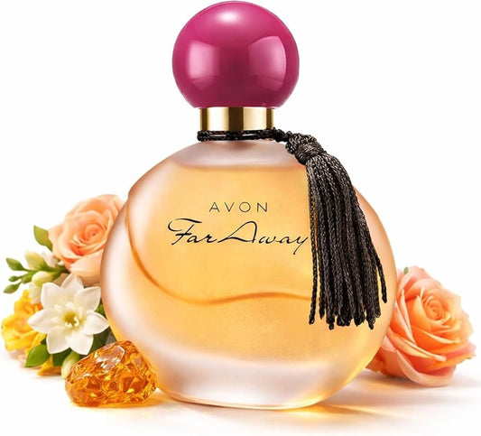 Avon Far Away perfume bottle with a pink spherical cap, gold neck ring, black tassel, and pale amber liquid, styled with peach roses and small flowers on a white background.
