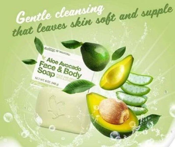 Aloe Avocado Face & Body Soap with avocado slices and leaves on a green background